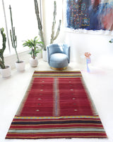Vintage kilim rug in living room setting, bright colors, wild shaman, soft rug, bold color, Portland, Oregon, rug store, rug shop, local shop, vintage rug, modern kilim, warm colors, antique kilim rug