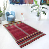 Vintage kilim rug in living room setting, bright colors, wild shaman, soft rug, bold color, Portland, Oregon, rug store, rug shop, local shop, vintage rug, modern kilim, warm colors, antique kilim rug