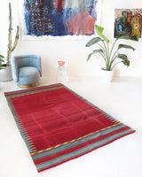 Vintage kilim rug in living room setting, bright colors, wild shaman, soft rug, bold color, Portland, Oregon, rug store, rug shop, local shop, vintage rug, modern kilim, warm colors, antique kilim rug