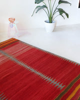 Vintage kilim rug in living room setting, bright colors, wild shaman, soft rug, bold color, Portland, Oregon, rug store, rug shop, local shop, vintage rug, modern kilim, warm colors, antique kilim rug