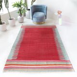 Vintage kilim rug in living room setting, bright colors, wild shaman, soft rug, bold color, Portland, Oregon, rug store, rug shop, local shop, vintage rug, modern kilim, warm colors, antique kilim rug