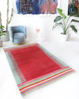 Vintage kilim rug in living room setting, bright colors, wild shaman, soft rug, bold color, Portland, Oregon, rug store, rug shop, local shop, vintage rug, modern kilim, warm colors, antique kilim rug