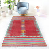 Vintage kilim rug in living room setting, bright colors, wild shaman, soft rug, bold color, Portland, Oregon, rug store, rug shop, local shop, vintage rug, modern kilim, warm colors, antique kilim rug