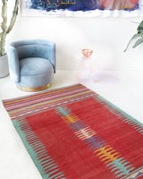 Vintage kilim rug in living room setting, bright colors, wild shaman, soft rug, bold color, Portland, Oregon, rug store, rug shop, local shop, vintage rug, modern kilim, warm colors, antique kilim rug