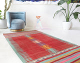 Vintage kilim rug in living room setting, bright colors, wild shaman, soft rug, bold color, Portland, Oregon, rug store, rug shop, local shop, vintage rug, modern kilim, warm colors, antique kilim rug