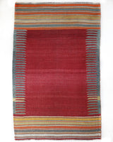 Vintage kilim rug in living room setting, bright colors, wild shaman, soft rug, bold color, Portland, Oregon, rug store, rug shop, local shop, vintage rug, modern kilim, warm colors, antique rug, antique kilim