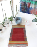 Vintage kilim rug in living room setting, bright colors, wild shaman, soft rug, bold color, Portland, Oregon, rug store, rug shop, local shop, vintage rug, modern kilim, warm colors, antique rug, antique kilim
