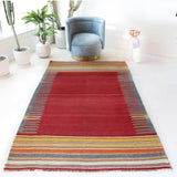 Vintage kilim rug in living room setting, bright colors, wild shaman, soft rug, bold color, Portland, Oregon, rug store, rug shop, local shop, vintage rug, modern kilim, warm colors, antique rug, antique kilim
