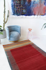 Vintage kilim rug in living room setting, bright colors, wild shaman, soft rug, bold color, Portland, Oregon, rug store, rug shop, local shop, vintage rug, modern kilim, warm colors, antique rug, antique kilim