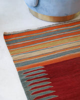 Vintage kilim rug in living room setting, bright colors, wild shaman, soft rug, bold color, Portland, Oregon, rug store, rug shop, local shop, vintage rug, modern kilim, warm colors, antique rug, antique kilim