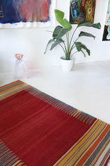 Vintage kilim rug in living room setting, bright colors, wild shaman, soft rug, bold color, Portland, Oregon, rug store, rug shop, local shop, vintage rug, modern kilim, warm colors, antique rug, antique kilim