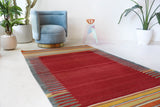 Vintage kilim rug in living room setting, bright colors, wild shaman, soft rug, bold color, Portland, Oregon, rug store, rug shop, local shop, vintage rug, modern kilim, warm colors, antique rug, antique kilim