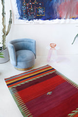 Vintage kilim rug in living room setting, bright colors, wild shaman, soft rug, bold color, Portland, Oregon, rug store, rug shop, local shop, vintage rug, modern kilim, warm colors, antique rug, antique kilim