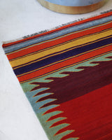 Vintage kilim rug in living room setting, bright colors, wild shaman, soft rug, bold color, Portland, Oregon, rug store, rug shop, local shop, vintage rug, modern kilim, warm colors, antique rug, antique kilim