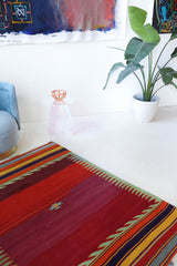 Vintage kilim rug in living room setting, bright colors, wild shaman, soft rug, bold color, Portland, Oregon, rug store, rug shop, local shop, vintage rug, modern kilim, warm colors, antique rug, antique kilim