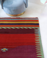 Vintage kilim rug in living room setting, bright colors, wild shaman, soft rug, bold color, Portland, Oregon, rug store, rug shop, local shop, vintage rug, modern kilim, warm colors, antique rug, antique kilim