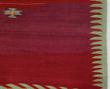 Vintage kilim rug in living room setting, bright colors, wild shaman, soft rug, bold color, Portland, Oregon, rug store, rug shop, local shop, vintage rug, modern kilim, warm colors, antique rug, antique kilim