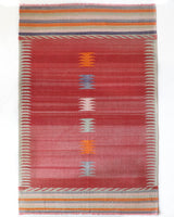 Vintage kilim rug in living room setting, old rug, antique rug, pastel colors, faded colors, Turkish rug, vintage rug, soft rug, Portland, Oregon, rug store, rug shop, local shop, earthy tones, earthy colors, warm colors