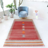 Vintage kilim rug in living room setting, old rug, antique rug, pastel colors, faded colors, Turkish rug, vintage rug, soft rug, Portland, Oregon, rug store, rug shop, local shop, earthy tones, earthy colors, warm colors