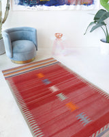 Vintage kilim rug in living room setting, old rug, antique rug, pastel colors, faded colors, Turkish rug, vintage rug, soft rug, Portland, Oregon, rug store, rug shop, local shop, earthy tones, earthy colors, warm colors