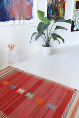 Vintage kilim rug in living room setting, old rug, antique rug, pastel colors, faded colors, Turkish rug, vintage rug, soft rug, Portland, Oregon, rug store, rug shop, local shop, earthy tones, earthy colors, warm colors