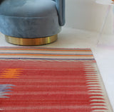 Vintage kilim rug in living room setting, old rug, antique rug, pastel colors, faded colors, Turkish rug, vintage rug, soft rug, Portland, Oregon, rug store, rug shop, local shop, earthy tones, earthy colors, warm colors