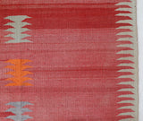 Vintage kilim rug in living room setting, old rug, antique rug, pastel colors, faded colors, Turkish rug, vintage rug, soft rug, Portland, Oregon, rug store, rug shop, local shop, earthy tones, earthy colors, warm colors