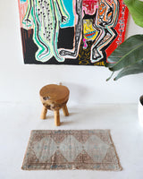 Vintage Turkish mini rug in room decor setting, old rug, antique rug, pastel colors, faded colors, Turkish rug, vintage rug, soft rug, Portland, Oregon, rug store, rug shop, local shop,  bright colors, bold colors