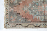 Vintage Turkish mini rug in room decor setting, old rug, antique rug, pastel colors, faded colors, Turkish rug, vintage rug, soft rug, Portland, Oregon, rug store, rug shop, local shop,  bright colors, bold colors