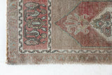 Vintage Turkish mini rug in room decor setting, old rug, antique rug, pastel colors, faded colors, Turkish rug, vintage rug, soft rug, Portland, Oregon, rug store, rug shop, local shop,  bright colors, bold colors