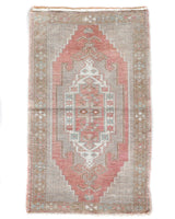 Vintage Turkish mini rug in room decor setting, old rug, antique rug, pastel colors, faded colors, Turkish rug, vintage rug, soft rug, Portland, Oregon, rug store, rug shop, local shop,  bright colors, bold colors