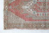 Vintage Turkish mini rug in room decor setting, old rug, antique rug, pastel colors, faded colors, Turkish rug, vintage rug, soft rug, Portland, Oregon, rug store, rug shop, local shop,  bright colors, bold colors