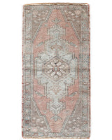 Vintage Turkish mini rug in room decor setting, old rug, antique rug, pastel colors, faded colors, Turkish rug, vintage rug, soft rug, Portland, Oregon, rug store, rug shop, local shop,  bright colors, bold colors