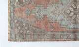 Vintage Turkish mini rug in room decor setting, old rug, antique rug, pastel colors, faded colors, Turkish rug, vintage rug, soft rug, Portland, Oregon, rug store, rug shop, local shop,  bright colors, bold colors