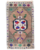Vintage Turkish mini rug in room decor setting, old rug, antique rug, pastel colors, faded colors, Turkish rug, vintage rug, soft rug, Portland, Oregon, rug store, rug shop, local shop,  bright colors, bold colors