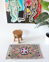 Vintage Turkish mini rug in room decor setting, old rug, antique rug, pastel colors, faded colors, Turkish rug, vintage rug, soft rug, Portland, Oregon, rug store, rug shop, local shop,  bright colors, bold colors