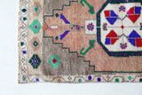 Vintage Turkish mini rug in room decor setting, old rug, antique rug, pastel colors, faded colors, Turkish rug, vintage rug, soft rug, Portland, Oregon, rug store, rug shop, local shop,  bright colors, bold colors