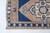 Vintage Turkish mini rug in room decor setting, old rug, antique rug, pastel colors, faded colors, Turkish rug, vintage rug, soft rug, Portland, Oregon, rug store, rug shop, local shop,  bright colors, bold colors