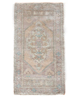 Vintage Turkish mini rug in room decor setting, old rug, antique rug, pastel colors, faded colors, Turkish rug, vintage rug, soft rug, Portland, Oregon, rug store, rug shop, local shop,  bright colors, bold colors