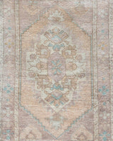 Vintage Turkish mini rug in room decor setting, old rug, antique rug, pastel colors, faded colors, Turkish rug, vintage rug, soft rug, Portland, Oregon, rug store, rug shop, local shop,  bright colors, bold colors
