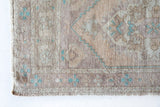 Vintage Turkish mini rug in room decor setting, old rug, antique rug, pastel colors, faded colors, Turkish rug, vintage rug, soft rug, Portland, Oregon, rug store, rug shop, local shop,  bright colors, bold colors