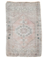 Vintage Turkish mini rug in room decor setting, old rug, antique rug, pastel colors, faded colors, Turkish rug, vintage rug, soft rug, Portland, Oregon, rug store, rug shop, local shop,  bright colors, bold colors