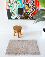 Vintage Turkish mini rug in room decor setting, old rug, antique rug, pastel colors, faded colors, Turkish rug, vintage rug, soft rug, Portland, Oregon, rug store, rug shop, local shop,  bright colors, bold colors