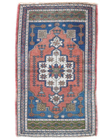 Vintage Turkish mini rug in room decor setting, old rug, antique rug, pastel colors, faded colors, Turkish rug, vintage rug, soft rug, Portland, Oregon, rug store, rug shop, local shop,  bright colors, bold colors
