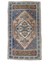 Vintage Turkish mini rug in room decor setting, old rug, antique rug, pastel colors, faded colors, Turkish rug, vintage rug, soft rug, Portland, Oregon, rug store, rug shop, local shop,  bright colors, bold colors