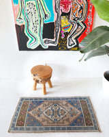 Vintage Turkish mini rug in room decor setting, old rug, antique rug, pastel colors, faded colors, Turkish rug, vintage rug, soft rug, Portland, Oregon, rug store, rug shop, local shop,  bright colors, bold colors