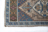 Vintage Turkish mini rug in room decor setting, old rug, antique rug, pastel colors, faded colors, Turkish rug, vintage rug, soft rug, Portland, Oregon, rug store, rug shop, local shop,  bright colors, bold colors