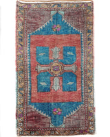 Vintage Turkish mini rug in room decor setting, old rug, antique rug, pastel colors, faded colors, Turkish rug, vintage rug, soft rug, Portland, Oregon, rug store, rug shop, local shop,  bright colors, bold colors