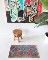 Vintage Turkish mini rug in room decor setting, old rug, antique rug, pastel colors, faded colors, Turkish rug, vintage rug, soft rug, Portland, Oregon, rug store, rug shop, local shop,  bright colors, bold colors