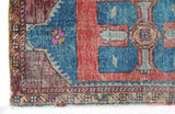 Vintage Turkish mini rug in room decor setting, old rug, antique rug, pastel colors, faded colors, Turkish rug, vintage rug, soft rug, Portland, Oregon, rug store, rug shop, local shop,  bright colors, bold colors